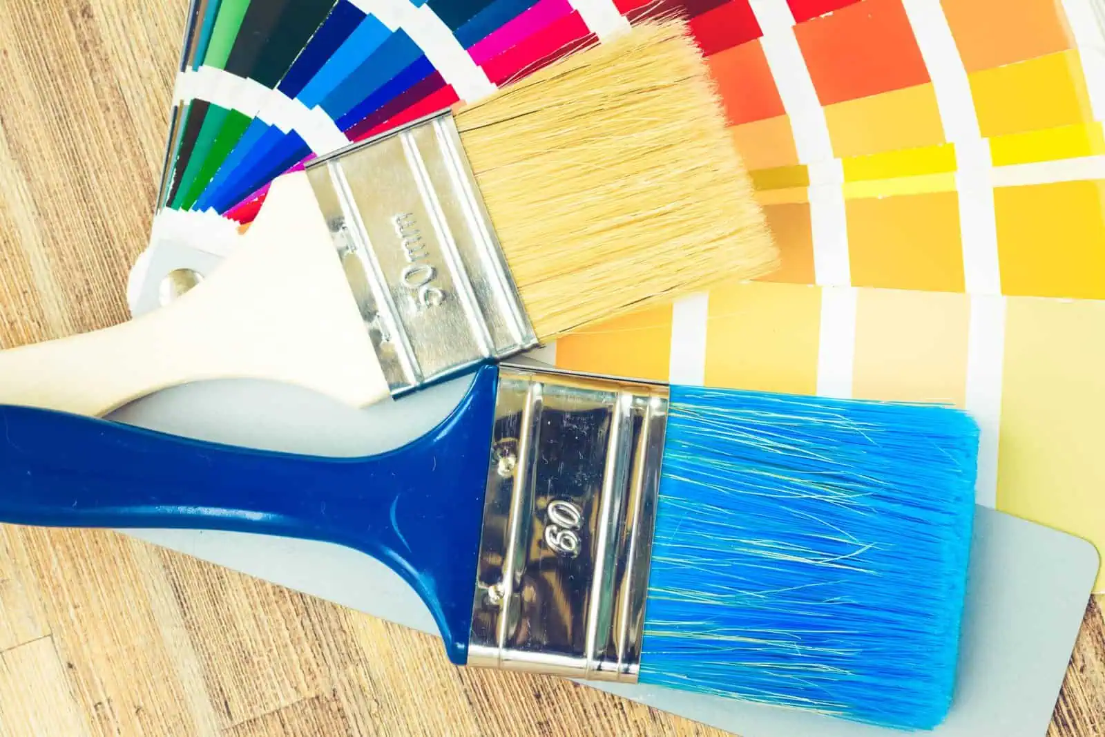 Paint brushes and color swatches for professional painting services.